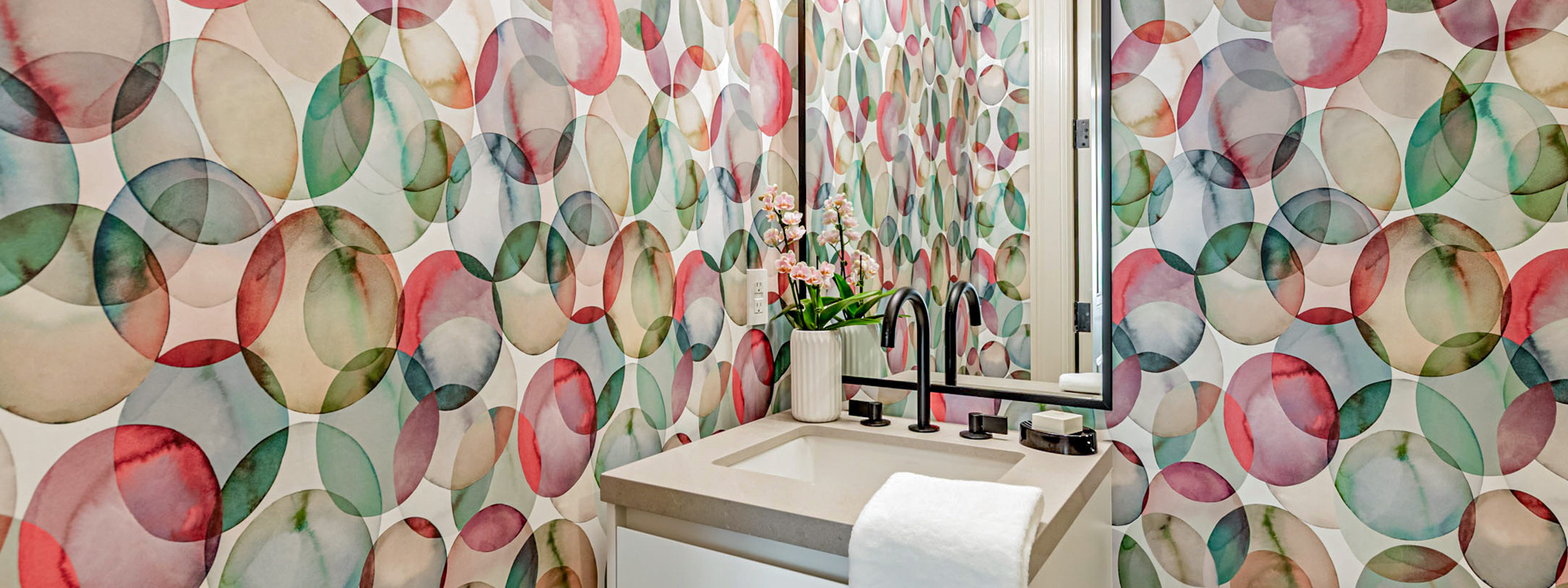 Pop, Fizz, Powder: a Toronto powder room wrapped in a colorful watercolor bubble wallpaper