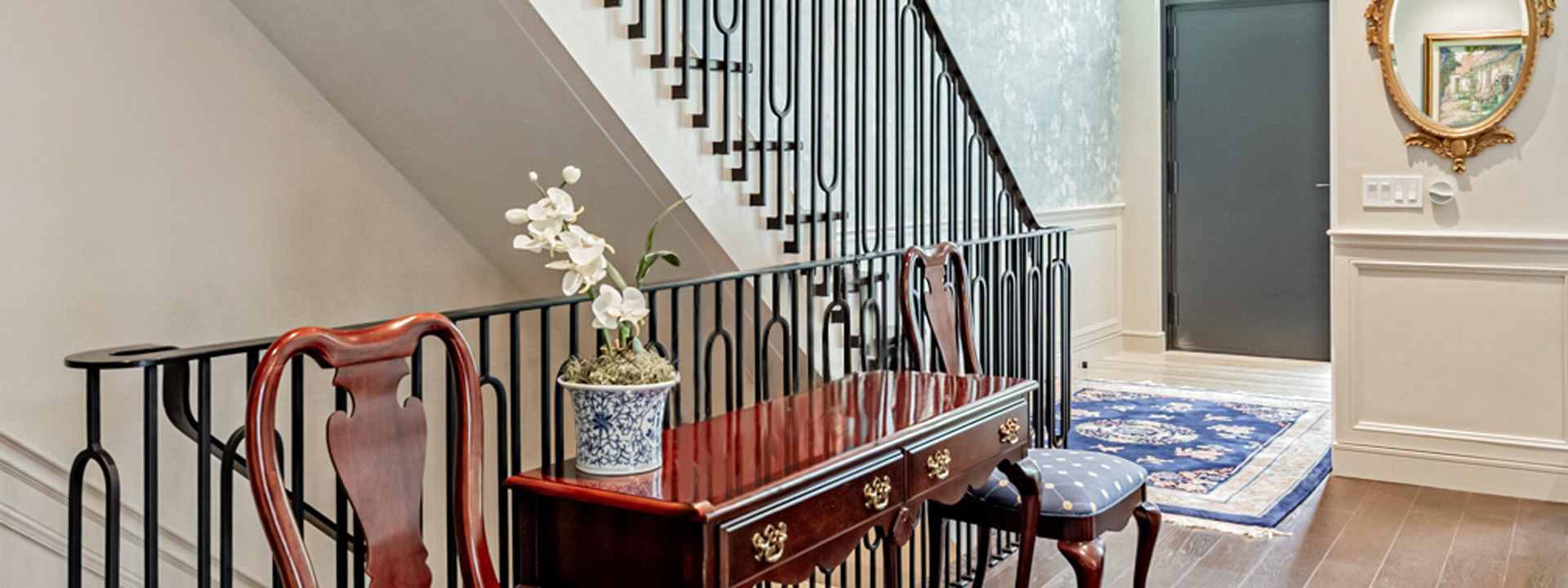 Porcelain Garden Stairway: a Toronto townhome entry and stairwell wrapped in floral Scalamandr&eacute; wallpaper